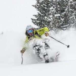 Skiing deep powder during snow storm.